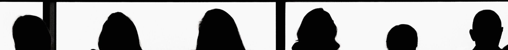 silhouettes of people against a window