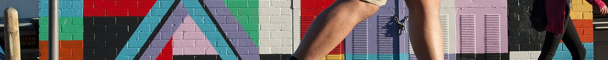 People walking past Cube Square by Brett Ashby