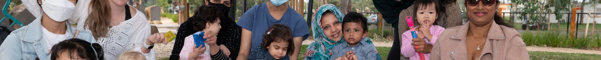 A group of children and mothers enjoying playgroup 