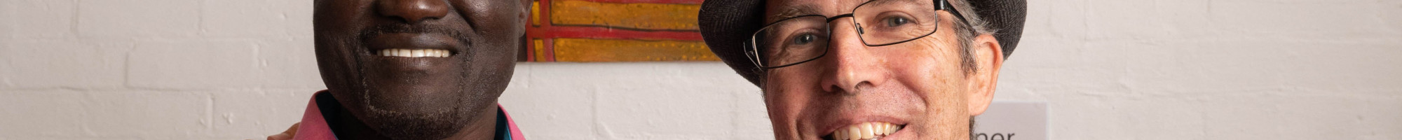 Artist and subject: Gora Odiel and Gabriel Hingley in front of the winning portrait. 