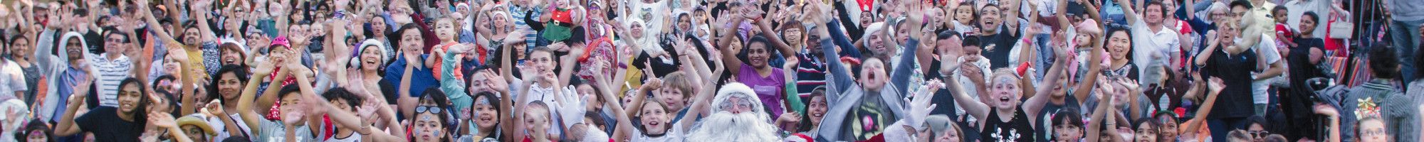 A group of people with Santa in Harmony Square