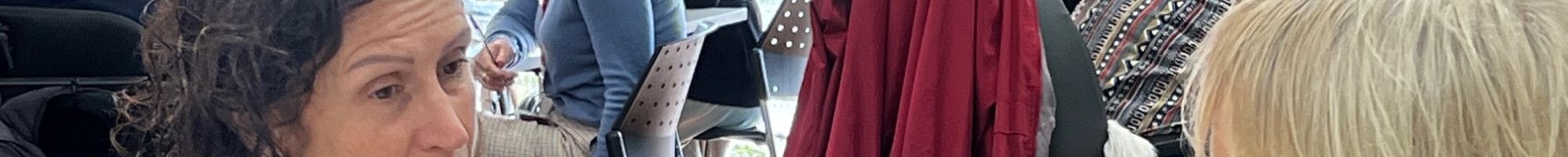 Two people sitting at a table talking