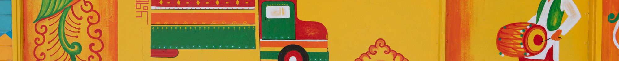 Painting on a wall of a truck and people