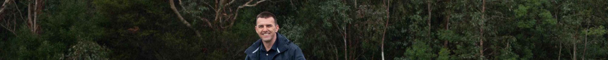 Councillor Bob Milkovic standing on the jetty at Tirhatuan Park