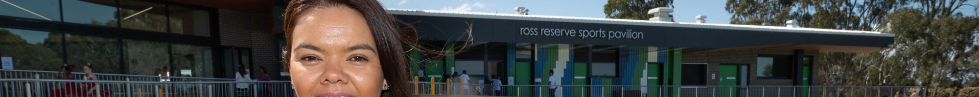 Mayor, Councillor Eden Foster in front of a new sports pavilion