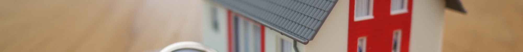 Small house and keys on a tabletop