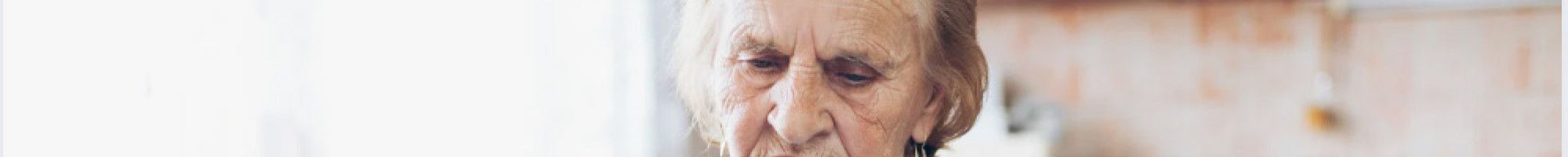 A lady looking at her bills