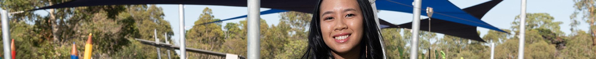 Cr Isabella Do standing in a park