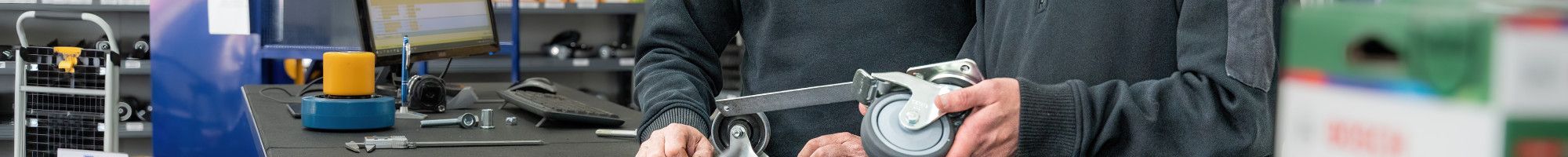 Two people working in a shop.