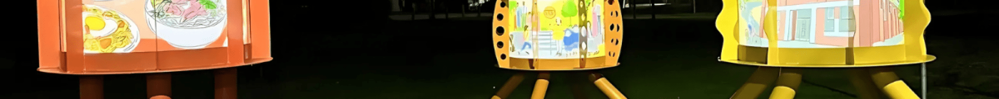 Three pudding lanterns at night in the park.