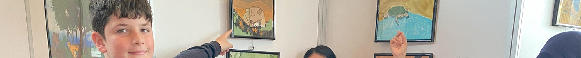 Children showing their artwork