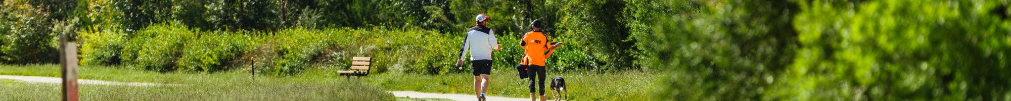 Two people walking on a track