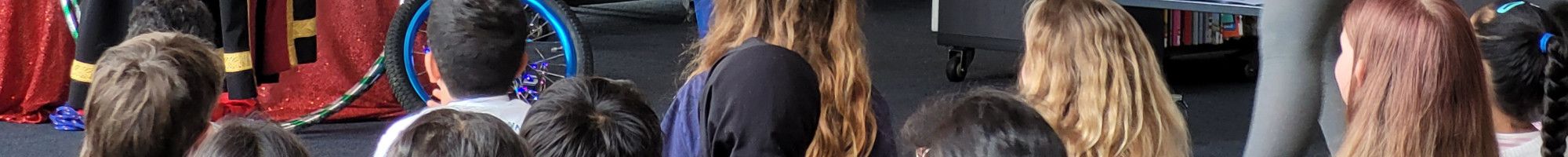 Children looking at a show in the library