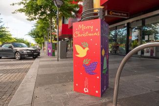 Christmas decorations above businesses in Dandenong