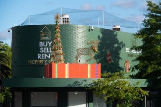 Christmas decorations above businesses in Dandenong