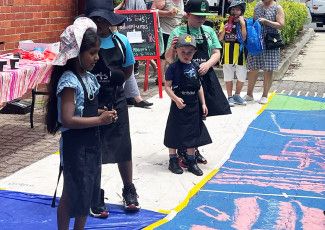 Children painting in the streets