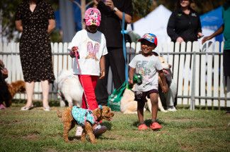 People walking a dog.