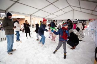 Attendees playing in the snow play area