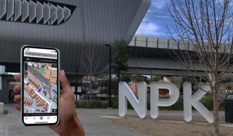 phone with map and Noble Park in background