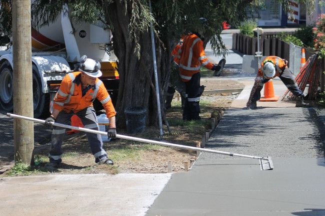 Workers constructing a footpath