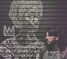 Man standing in front of a painting